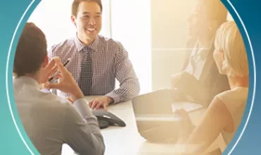 Group of people having a meeting in a bright office.